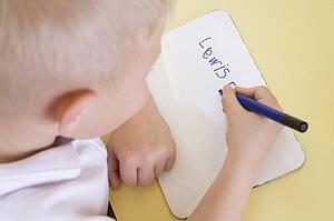 Student in class learning spelling (selective focus)