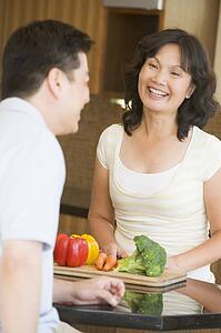 Husband And Wife Preparing meal, mealtime Together