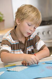 Young Boy Drawing Pictures