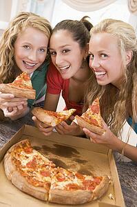 Teenage Girls Eating Pizza 