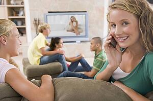 Teenagers Hanging Out In Front Of Television 
