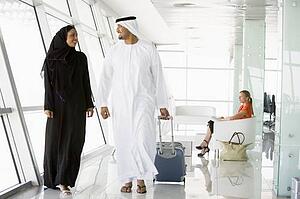 Airline passengers waiting in departure gate