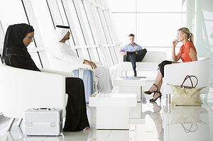 Airline passengers waiting in departure gate