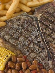 T-Bone Steak with Fries Corn and Beans