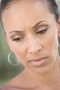 Head shot of woman scowling