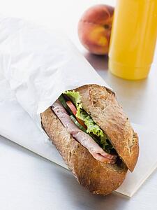 Ham And Salad Granary Baguette With Mango And Banana Smoothie And A Nectarine