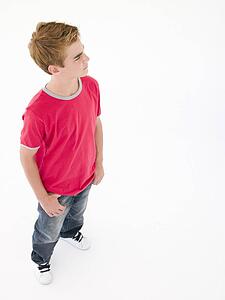 Teenage boy with hands in pockets