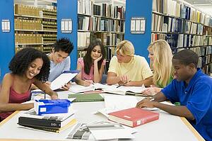 Six people in library studying