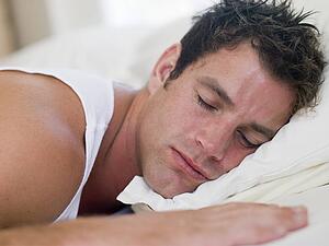 Man lying in bed sleeping
