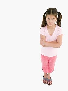 Young girl with arms crossed angry