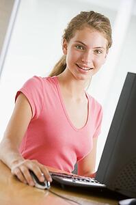 Teenage Girl Using Desktop Computer 