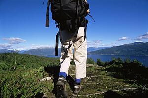 Woman's legs outdoors while hiking in scenic location