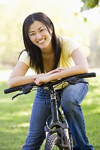 Woman on bicycle smiling