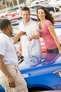 Young couple shopping for a new car