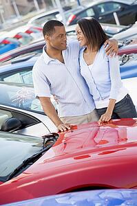 Young couple shopping for a new car