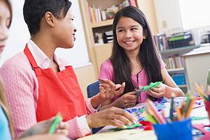 Teacher and student in art class (selective focus)