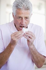 Man Blowing His Nose