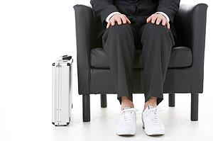 Businessman Holding Wearing Sneakers 