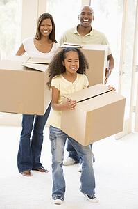 Family moving into new home smiling