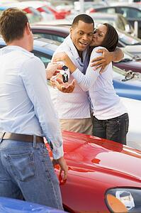 Young couple shopping for a new car