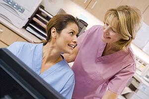 Nurses At The Reception Area Of A Hospital