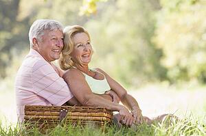 Couple at a picnic smiling