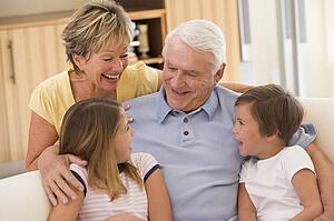Grandparents laughing with grandchildren.