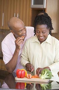 Husband And Wife Preparing A meal, mealtime Together
