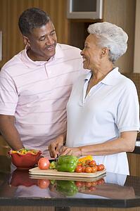 Husband And Wife Preparing meal, mealtime Together
