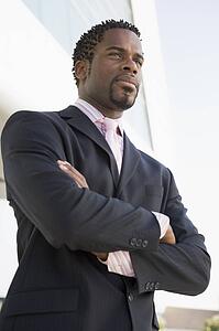 Businessman standing outdoors by building
