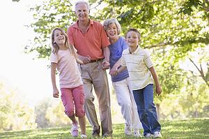 Grandparents walking with grandchildren.
