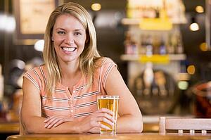 Woman having a glass of beer