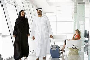 Airline passengers waiting in departure gate