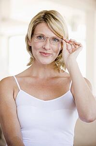 Woman Looking Through New Glasses
