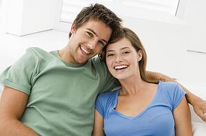 Couple in living room smiling