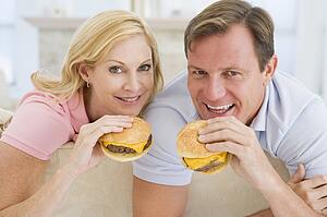 Couple Enjoying Burgers Together