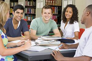 Five people in library studying (selective focus)