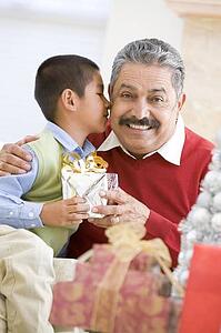 Boy Surprising Father With Christmas Present