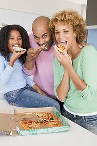 Family Eating Pizza Together 