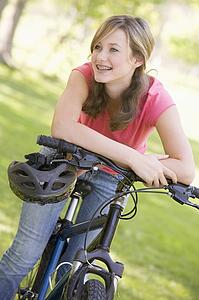 Teenage Girl On Bicycle