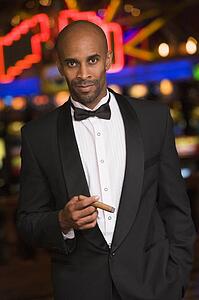 Man in casino smoking cigar (selective focus)