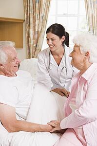 Doctor Talking To Senior Man And His Wife