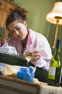 Young woman at home waiting by telephone