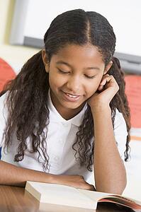 Student in class reading book