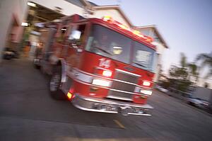 Fire engine leaving firehouse (blur)