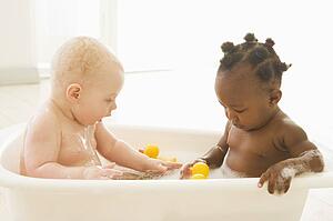 Two babies in bubble bath