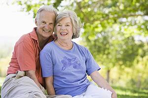 Senior couple sitting outdoors