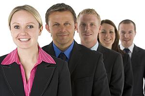 Group Of Business People In A Line Smiling