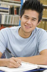 Man sitting in library studying
