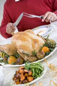 Man Preparing To Carve A Turkey